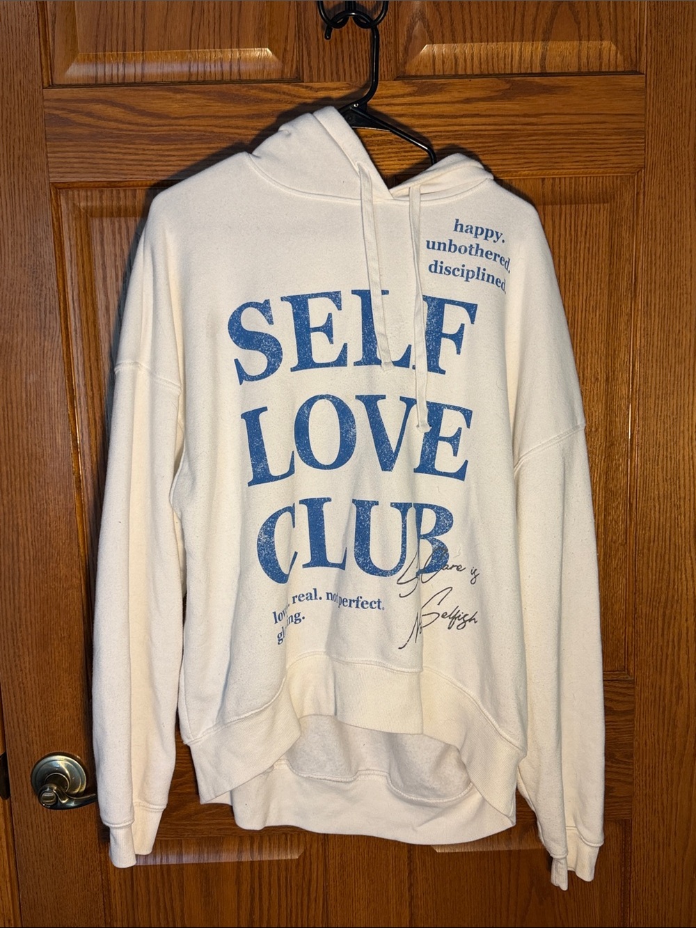 Grayson Threads Cream Pullover Sweatshirt with Black Logo Tag